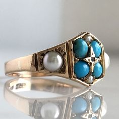 Details: Sweet European made Victorian cluster turquoise ring with pearls and a rose cut diamond in the center. A very beautiful ring with 15K yellow gold, bright blue turquoise stones, Pearls, seed pearls and a rose cut diamond. This piece is so sweet. The center stone area of the ring measures 18mm wide x 10mm at the widest point. Hallmarked 15CT. Please ask all necessary questions prior to placing an order. Measurements: The size is 7 US and can be sized for a fee. Condition: The overall all Vintage Yellow Gold Turquoise Ring For Wedding, Vintage Yellow Gold Turquoise Wedding Ring, Gold Multi-stone Turquoise Ring For Wedding, 14k Gold Turquoise Ring For Wedding, Hallmarked Turquoise Yellow Gold Ring For Wedding, Heirloom Yellow Gold Turquoise Ring For Wedding, Hallmarked Yellow Gold Turquoise Ring For Wedding, Elegant Hallmarked Turquoise Wedding Ring, Fine Jewelry Turquoise Wedding Ring