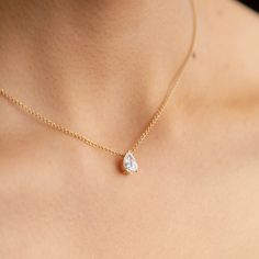 The ultimate timeless piece. A solitaire pear is centered between the collarbone on an 18k gold chain. The length of this necklace is 16" (40cm). Please get in touch if you would like a different chain length. Shape, color, and size of this pear diamond necklace are fully customizable as well. Pear Diamond Pendant, Pear Diamond Necklace, Minimal Pendant, Pretty Jewelry Necklaces, 18k Gold Chain, Pearl And Diamond Necklace, Diamond Solitaire Necklace, Travel Jewelry Case, Solitaire Necklaces