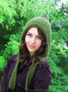 a woman wearing a green hat and scarf