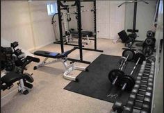 a home gym with weight machines and exercise mats