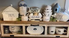 a wooden shelf filled with dishes and cups