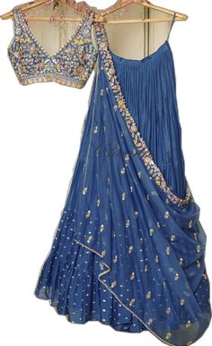 Blue Silk Lehenga With Traditional Drape, Blue Gown With Dori Work In Traditional Drape, Blue Gown With Dori Work And Traditional Drape, Festive Long Georgette Dupatta, Blue Designer Dress With Sheer Dupatta, Traditional Blue Dresses With Dori Work, Fitted Pre-draped Saree With Dabka Work In Georgette, Bollywood Style Fitted Pre-draped Saree With Dabka Work, Traditional Drape Blue Dresses With Dori Work