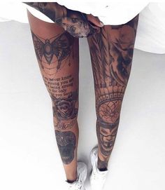 a woman's legs with tattoos on them