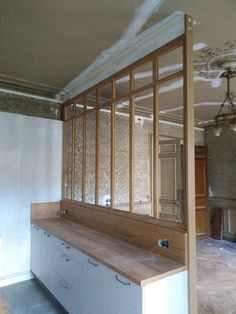 an empty room with unfinished walls and cabinets