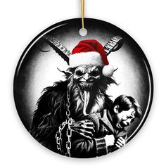 a round ornament with an image of a demon and a child wearing a santa hat