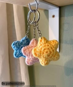 three crocheted stars hanging from a hook