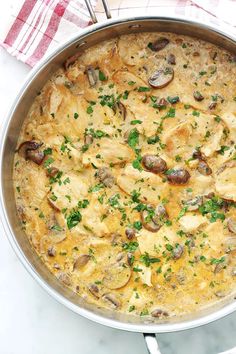 a pan filled with food sitting on top of a table