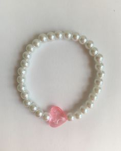 pink heart bracelet ༉ ༄ length ~ 7in ༄ price ~ $4 Trendy White Heart Charm Bracelet, Elegant Pink Stretch Bracelet For Everyday, Adjustable Pearl Bracelet With Heart Beads For Valentine's Day, Elegant Pink Beaded Bracelets With Heart Beads, Elegant Pink Beaded Bracelet With Heart Charm, Elegant Pink Heart Beaded Bracelets, Elegant Pink Heart-shaped Beaded Bracelets, Adjustable Heart Crystal Bracelet With Heart Charm, Adjustable Crystal Heart Bracelet With Charm