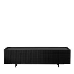 the soundbar is black and has an electronic device on it's side,