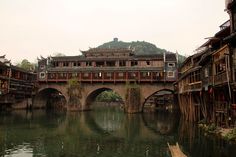 an old bridge over a body of water