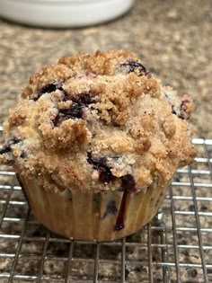 a muffin sitting on top of a cooling rack