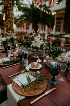 the table is set with place settings for dinner