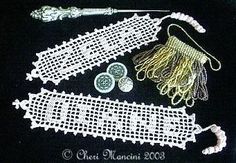 several different types of beading on a black surface with white trimmings and beads