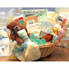 a baby's first year gift basket with a teddy bear