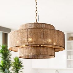 a chandelier hanging from a ceiling in a kitchen