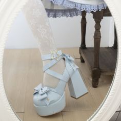 Elevate your style with our Blue Kawaii Lolita Bow Star Chunky Platform High Block Heels. Crafted from glossy blue patent leather, these statement heels feature charming bow details at the front and back, complemented by a star-shaped metal buckle. The high block heel and chunky platform offer both height and comfort, making them perfect for coquette, kawaii, Lolita, or pastel fashion enthusiasts. Glossy blue patent leather for a vibrant, luxurious look Bow details at the front and back for added charm Star-shaped metal buckle for a playful touch High block heel and chunky platform for height and comfort Ideal for coquette, kawaii, Lolita, and pastel aesthetics Harajuku Style Heels For Summer Parties, Cute Bow Heels With Round Toe, Cute Heels With Bow And Round Toe, Cute Closed Toe Heels With Bow, Cute Round Toe Heels With Bow, Summer Harajuku High Heels, Harajuku High Heels For Summer, Harajuku Ankle Strap Heels For Party, Kawaii Platform Heels With Round Toe