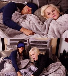 three women laying in bed with blankets on top of them and one woman sticking out her tongue