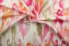 a pink and orange abstract print fabric