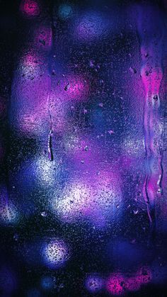 rain drops on the window with purple and blue colors