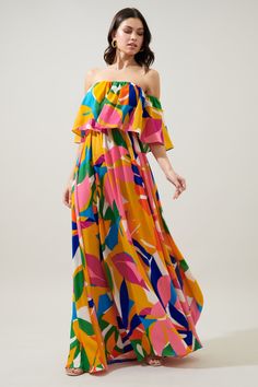 Keep things bold and bright in the Soleil Maxi. A fun abstract floral print works to shape the Enamored silhouette, featuring an off the shoulder ruffle detail. An elastic waist creates shape at the waist, topping an elongated maxi skirt. The perfect summer wedding guest dress that can be paired with heels of choice an Colorful Bold Print Beach Dress, Summer Wedding Colors Bright, Flowy Multicolor Off-shoulder Maxi Dress, Summer Off-shoulder Multicolor Maxi Dress, Chic Multicolor Off-shoulder Maxi Dress, Off The Shoulder Ruffle Dress, Vibrant Print A-line Beach Dress, Summer Wedding Guest Dress, Flowery Dresses