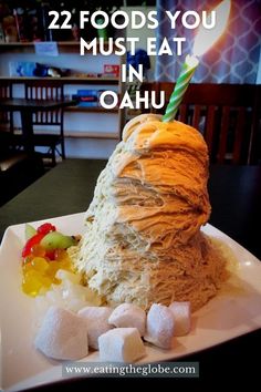 a plate with food on it and the words 22 foods you must eat in oahuu