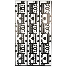 a metal screen with numbers and arrows on the front, in an ornate design pattern