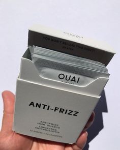 someone is holding up an anti - frizz box