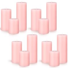 six pink candles arranged in rows on a white background