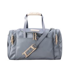 Our most popular duffel is perfect in both form and function. With two compartments in each side and a U-shaped zipper up top, you can stay organized and find what you need when you need it. The trolley sleeve on back makes traveling a breeze. Just slip it over the extended handle of a rolling suitcase and this carry-on compliant bag is ready to roll. Functional Duffle Bag With Zipper For Weekend Trips, Gray Travel Bag With Zipper Closure, Functional Travel Bag With Ykk Zipper, Functional Luggage With Zipper Closure For Weekend Trips, Gray Travel Bag With Luggage Sleeve, Functional Gym Bag With Zipper Closure For Trip, Gray Rectangular Duffle Bag For Travel, Toddler Pajamas, Diaper Changing Pad