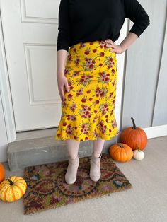 Yellow with red flowers flounce or peplum skirt made with a comfortable, stretchy knit fabric that compliments any body shape or size.  Elastic waist.  Custom lengths!  Teenagers and sister missionaries love these!   MATERIAL:  95 % polyester, 5% spandex, stretch knit CARE INSTRUCTIONS:  Machine wash cold, Non-Chlorine Bleach, Tumble dry low THANK YOU for visiting our shop!  We hope to offer you an amazing experience with the highest quality, fast shipping and delightful customer service. RETURN POLICY:  Returns or exchanges NOT ACCEPTED.  But please contact me if you have problems with your order. Fitted Floral Print Maxi Skirt, Fitted Red Skirt With Ruffle Hem, Red Stretch Skirt With Ruffles, Fitted Red Ruffled Skirt, Stretch Floral Print Tiered Skirt, Red Fitted Ruffled Skirt, Floral Print Stretch Tiered Skirt, Red Fitted Ruffle Skirt, Fitted Red Skirt With Floral Print