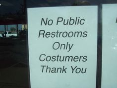 a sign that is on the side of a window saying no public restrooms only customers thank you