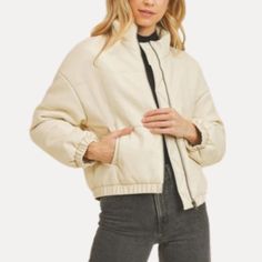 A Sleek, Versatile Essential. With A Zip-Up Front, Drop Shoulders, And Long Sleeves, This Jacket Effortlessly Blends Classic And Contemporary Styles. The Pristine White Hue Adds A Touch Of Sophistication, Ensuring Versatility From Day To Night. Versatile White Outerwear With Pockets, Beige Cotton Cropped Jacket For Winter, Casual Cream Cropped Jacket For Fall, Trendy Cream Cropped Jacket For Fall, Versatile White Outerwear For Spring, Trendy Cream Cotton Outerwear, Trendy White Cropped Jacket For Fall, Trendy White Outerwear For Fall, Versatile Long Sleeve Cream Outerwear