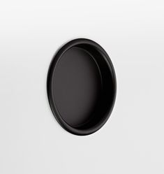 a black and white photo of a round object