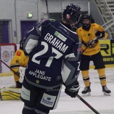 the hockey players are playing on the ice