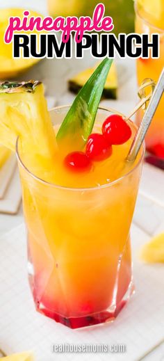 the pineapple rum punch is garnished with cherries