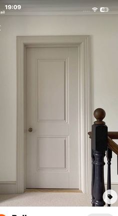 an open door is shown on the wall next to a stair case in this home