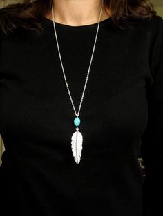 "Silver feather & turquoise necklace, Long silver feather necklace, Silver boho necklace, Bohemian necklace, Layering necklace This listing is for a long striking silver feather and turquoise necklace.  Measurements:  Length - 27\" (68.5cm) Turquoise and feather pendant - 4\" (10cm) If you have any questions, please contact me. The necklace comes boxed ready for gifting.   Thanks for looking. Matching earrings available https://www.etsy.com/uk/listing/550032670/silver-feather-and-turquoise-earri Feather Necklace Gift, Bohemian Long Silver Turquoise Necklace, Adjustable Bohemian Necklaces With Feathers, Silver Feather Pendant Jewelry, Turquoise Bohemian Jewelry With Feathers, Bohemian Turquoise Jewelry With Feathers, Bohemian Silver Necklace With Feathers, Bohemian Feather Jewelry Gift, Bohemian Long Silver Chain Necklace