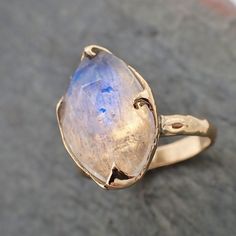 I created this setting in wax then cast it in recycled solid 14k gold at my home studio. This ring is a size 7 it can be resized up or down. The stone is rainbow moonstone. it measures about 17.5mm X 12mm I created a rustic texture in the gold. Throughout all time and history, in every tribe and culture all around the world crystals, minerals and gemstones have used for healing, luck, divination, adornment vibrational medicine and so much more.A stone for new beginnings, Moonstone is a stone of Dainty Rings, Rustic Texture, Wedding Rings Solitaire, Pretty Stuff, Mehndi Designs For Hands, Minerals And Gemstones, Raw Diamond, Gold Wedding Rings, Yellow Gold Ring