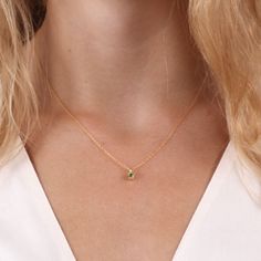 A 4mm peridot rests beneath a sleek high polish bail, offering you a pop of color to go with any outfit. Classic Yellow Gold May Birthstone Necklace, Classic Peridot Birthstone Jewelry, Classic Peridot Jewelry For May Birthstone, Elegant Peridot Birthstone Necklace, Minimalist Peridot Birthstone Jewelry, Elegant Green Peridot Birthstone Necklace, 14k Gold Green Jewelry With Single Diamond, Classic Gold Jewelry With Peridot, Elegant Green Birthstone Necklace In 14k Gold