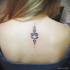 a woman with a tattoo on her back