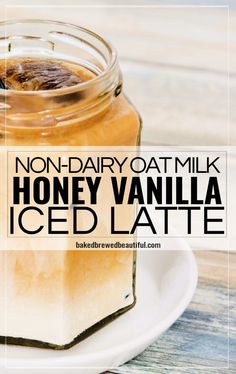 a glass jar filled with honey vanilla iced latte on top of a white plate