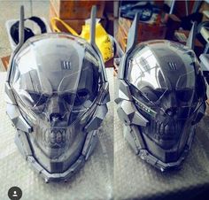 two helmets with skulls on them sitting on a table