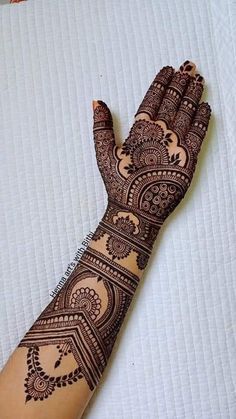 a henna tattoo on someone's hand