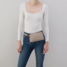 Go handsfree and travel light with the Fern Slim Belt Bag. Fern Slim Belt Bag In Pebbled Leather  Taupe BELT BAGSLING in Taupe | Hobo® Leather Belt Bag With Cell Phone Pocket For On-the-go, Versatile On-the-go Shoulder Bag With Smooth Grain, Textured Leather Travel Bags In Taupe, Versatile Belt Bag For On-the-go, Taupe Textured Leather Travel Bag, Versatile Shoulder Bag With Smooth Grain For Everyday Use, Versatile Smooth Grain Shoulder Bag, Leather Travel Accessories For Everyday Use, Versatile Pouch With Adjustable Strap For On-the-go