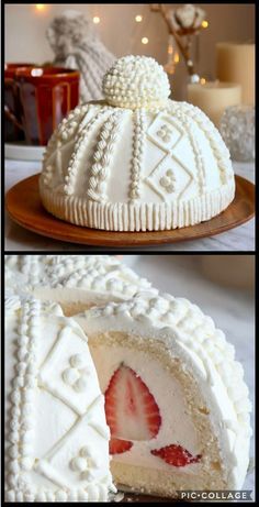 a cake that has been decorated with white frosting and strawberries on top, is cut in half to show the inside