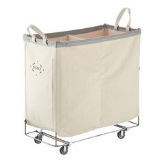 the laundry hamper is on wheels and has a canvas cover over it's sides