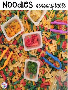 several plastic containers filled with different types of pasta