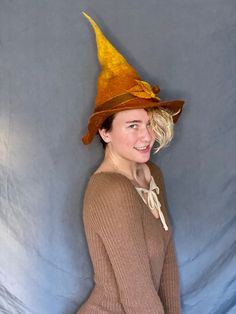 This autumnal witch hat is for the witch in your life who loves the changing of the seasons, or to go the extra mile in your costume this year. The brim has intentional holes to show the wear and tear of a true, age-defying witch. Wet felted for a long lasting, structured feel. Made from 100% merino wool. Perfect for cosplay, everyday witching, dress-up, fashion, or LARPing. Fitted Hat For Fall Costume Party, Witchy Wide Brim Hat For Fall, Brimmed Felt Hat For Halloween Costume, Halloween Costume Felt Hat With Brim, Fall Costume Hats With Curved Brim, Halloween Costume Felt Hat, Curved Brim Costume Hats And Headpieces For Fall, Witchy Costume Hats With Curved Brim For Fall, Witchy Costume Hat For Fall