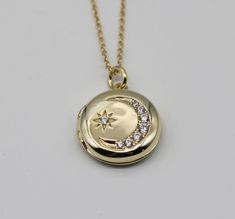 "This antique style locket is made of .925 sterling silver and plated in 14K gold.  It features a star and crescent moon lined in cubic zirconia stones.  It opens to hold two photographs. ~18\"  adjustable gold vermeil chain" Moon Locket, Stars Jewelry, Schmuck Gold, Silver Locket Necklace, Picture Locket, Photo Locket, Witchy Woman, Silver Lockets, Star Jewelry