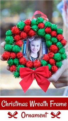 a christmas wreath frame with red and green pom - poms